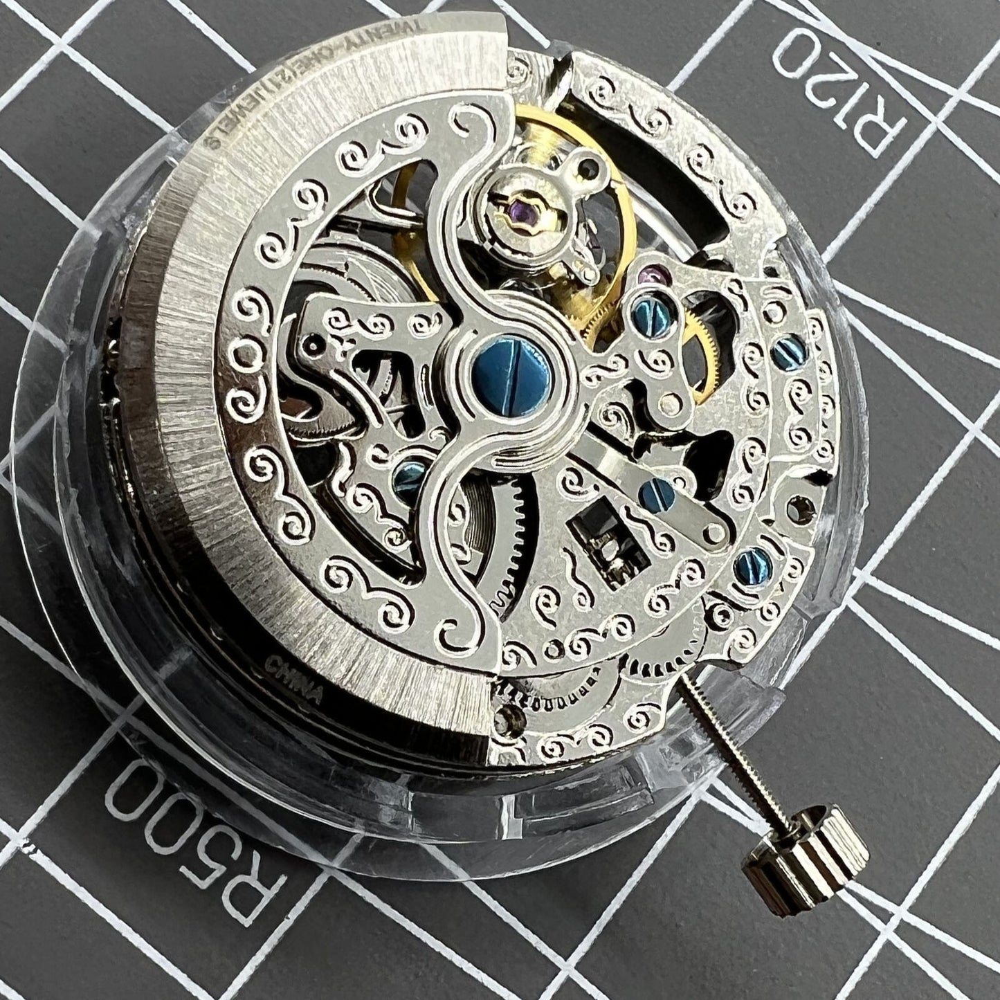 TY2807 skeleton automatic watch movement replacement part displaying intricate mechanical design for T16 models.