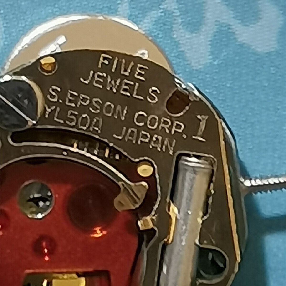 Epson YL50A quartz watch movement with 5 jewels, 2 hands, Japan-made for precise watch repairs.