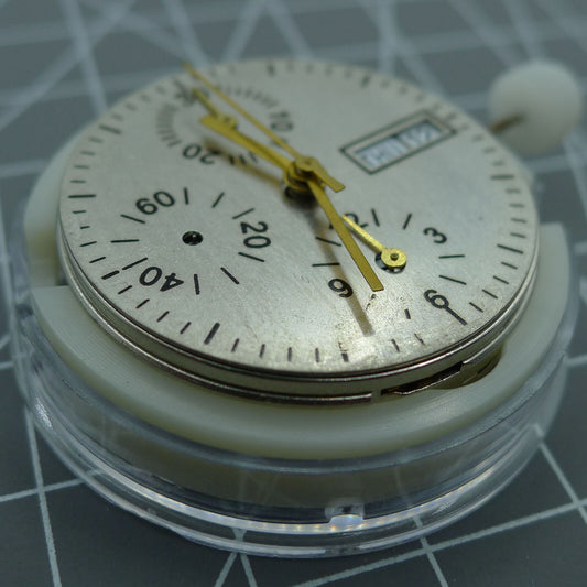 ETA 7750 automatic chronograph watch movement displaying day and date at 3 o'clock position.