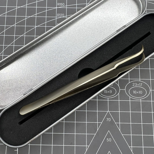 Golden curved elbow stainless steel tweezers for precise watch accessory handling.