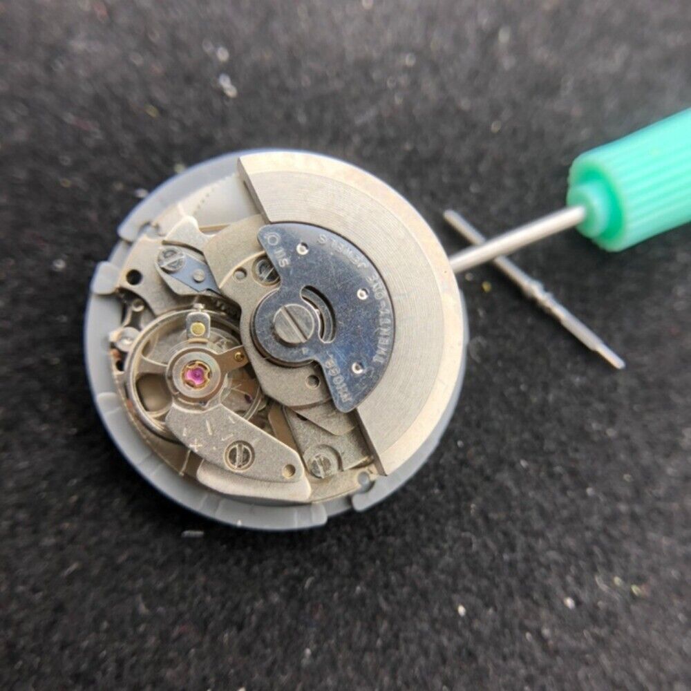 Seiko SII NH06 automatic watch movement with date display at 3 o'clock, precision Japan-made accessory.