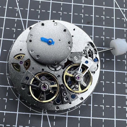 Multifunctional automatic watch with mechanical movement and dual balance wheels.