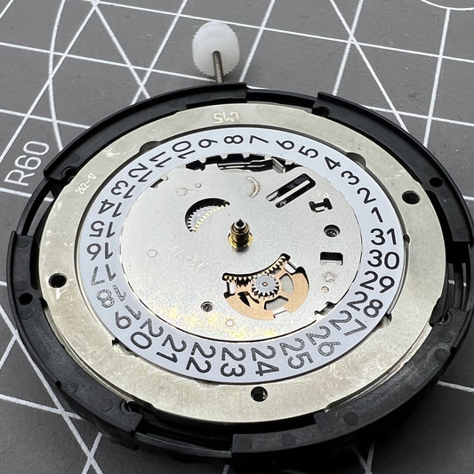 Swiss Made ETA C15.111 chronograph watch movement by 1853 with white dial and mechanical precision.