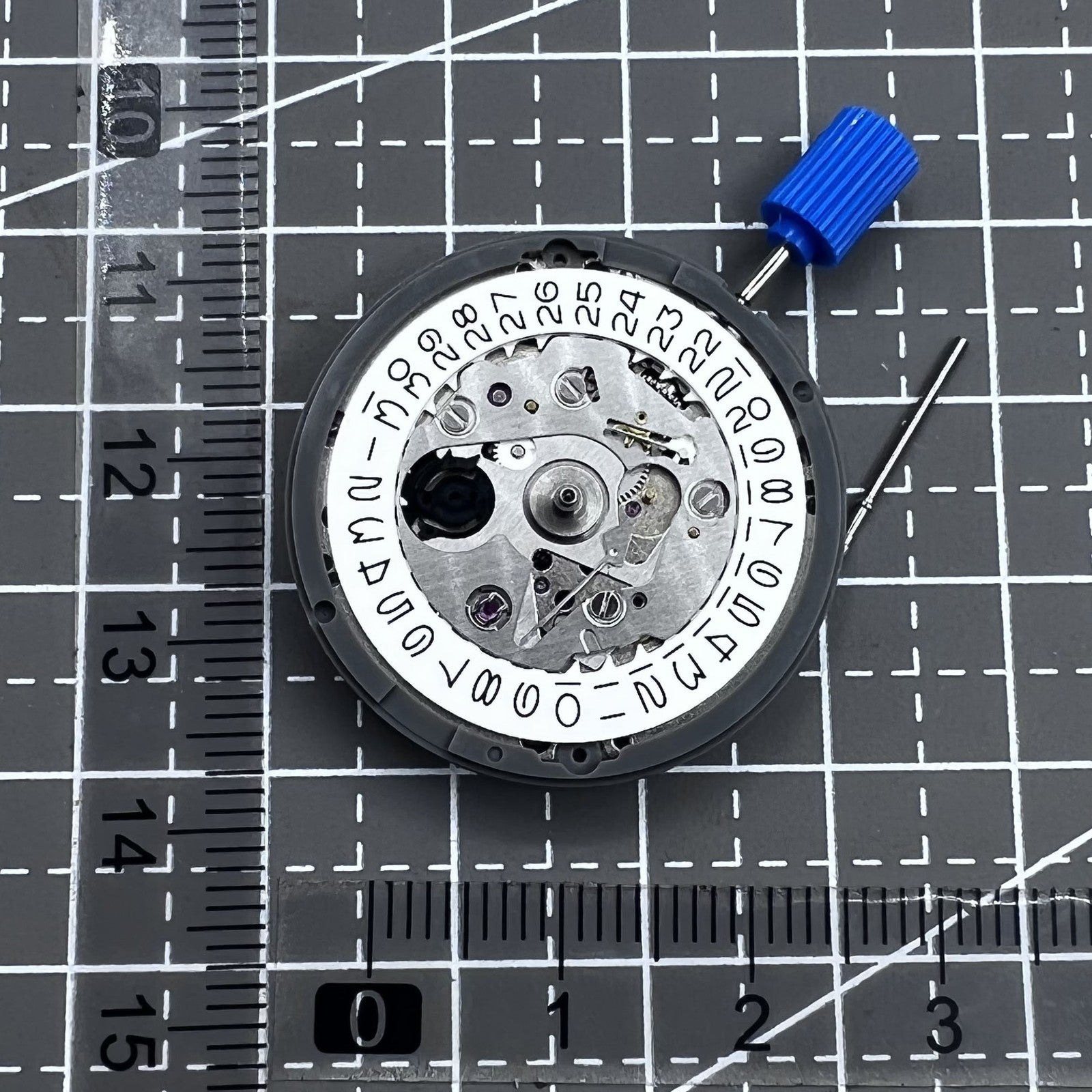 Seiko NH35 automatic watch movement with white dial, renowned for high accuracy and reliability.