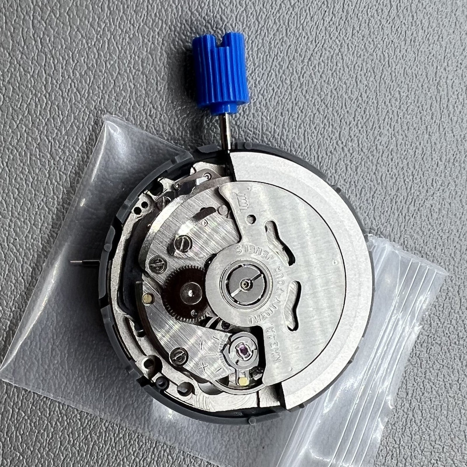 Seiko NH34 automatic GMT movement with hacking seconds for precise timekeeping and smooth operation.