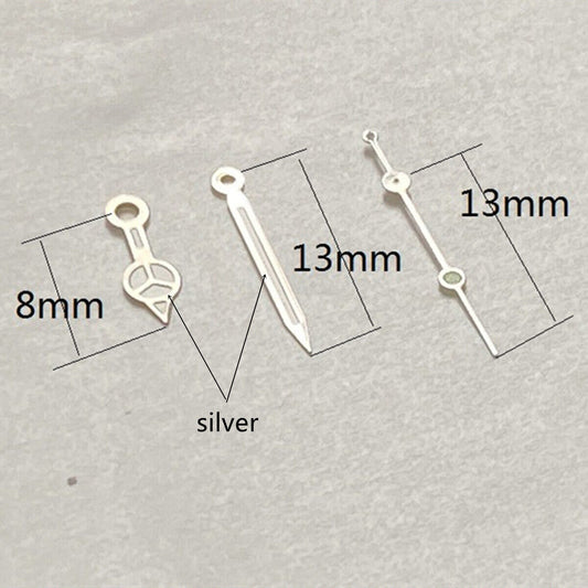 13mm silver-trimmed watch hands with green lume, designed for Ronda 515 quartz, ideal for precise timekeeping.