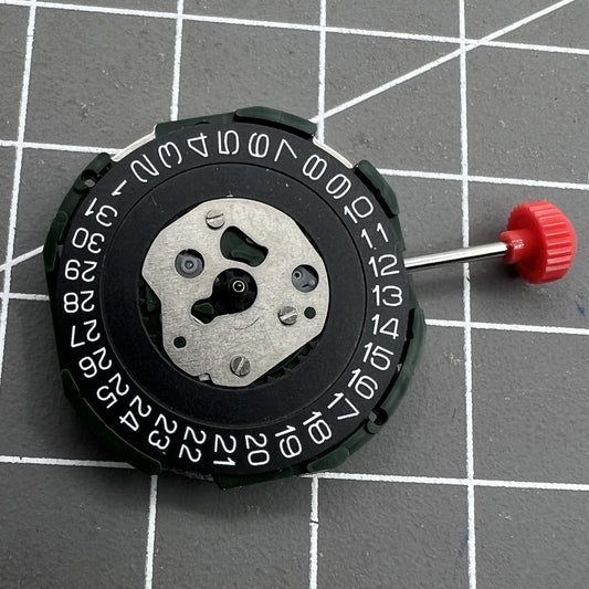 Miyota 2115 quartz watch movement with black date disk, single calendar, and three hands for precise timekeeping