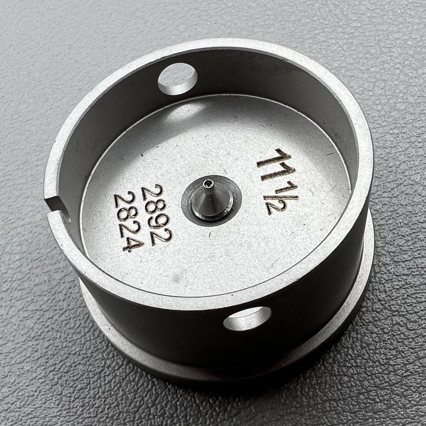 Size 11-1/2 Ligne ETA 2892/2824 movement holder with center screw for precise watch repair by ETA.