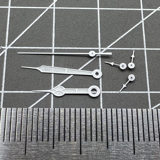 Silver-trimmed green luminous watch hands set for Miyota 0S20 quartz movement, enhancing dial visibility.