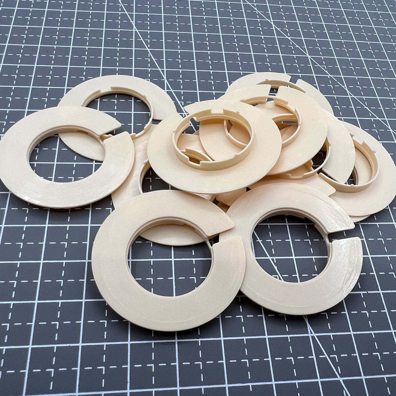 Set of 12 T-676 watch casing rings size 8.75 by Brand for precise movement spacer alignment.