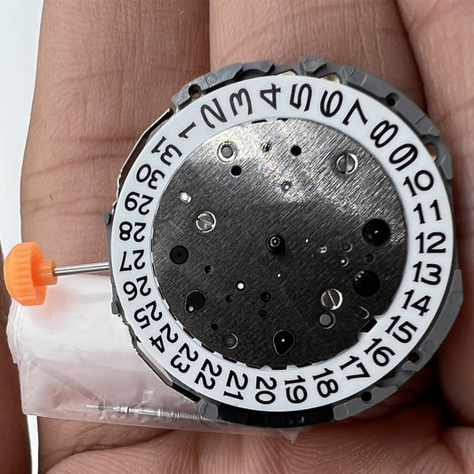 Miyota JS15 Japan Quartz watch movement with small second and date display at 6 o'clock.