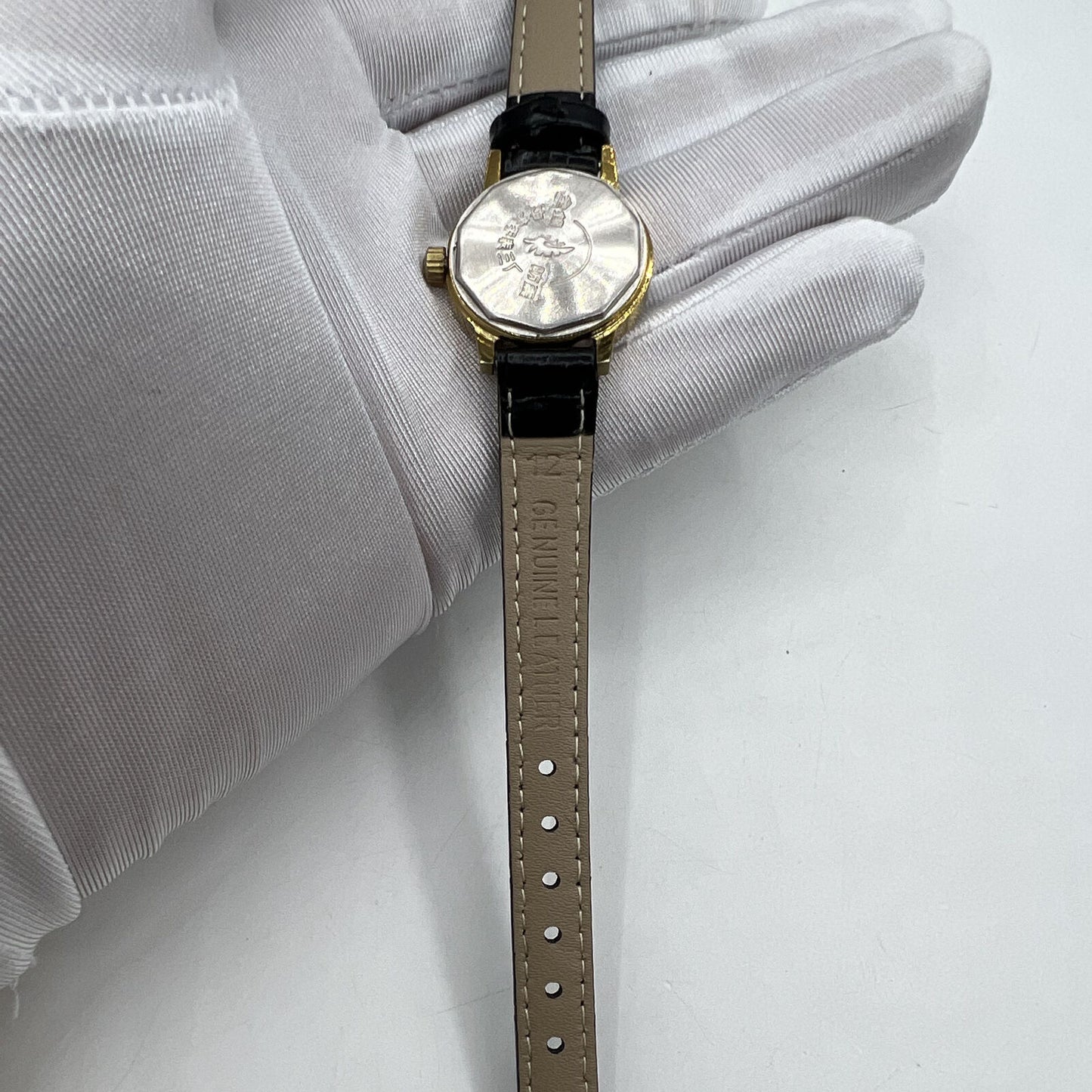 27mm Kongque watch with silver dial, gold markers, manual mechanical movement, 19 jewels, China made.