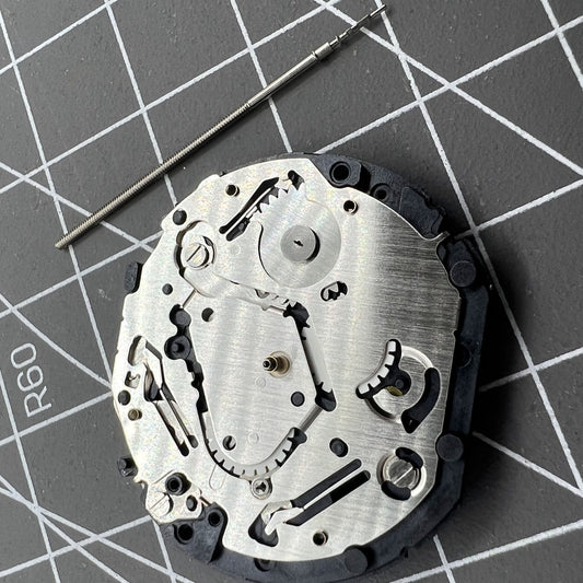 Japan Made Hattori Epson TMI VX7P VX7PE quartz watch movement, precise timekeeping component.