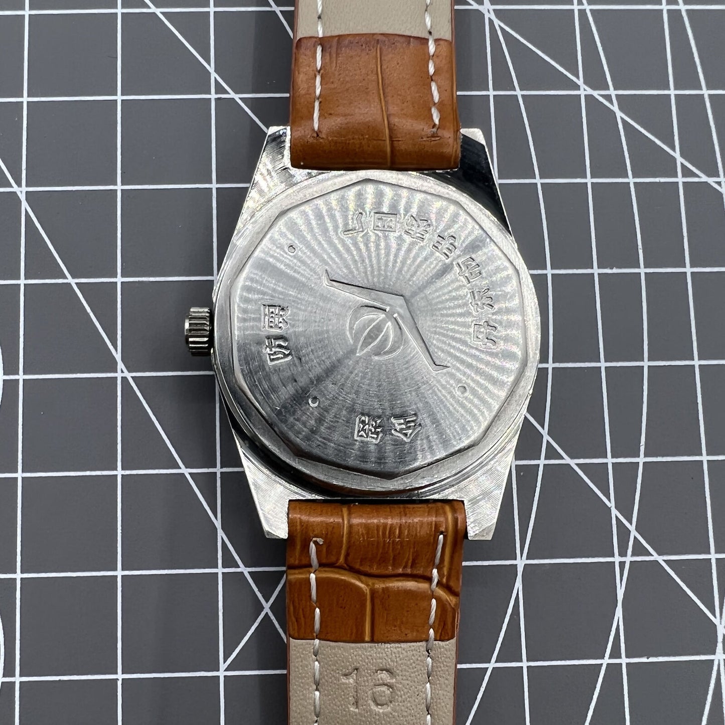 Chunlan 33mm steel manual watch with silver dial, 17-jewel movement, and sleek black band for classic style.