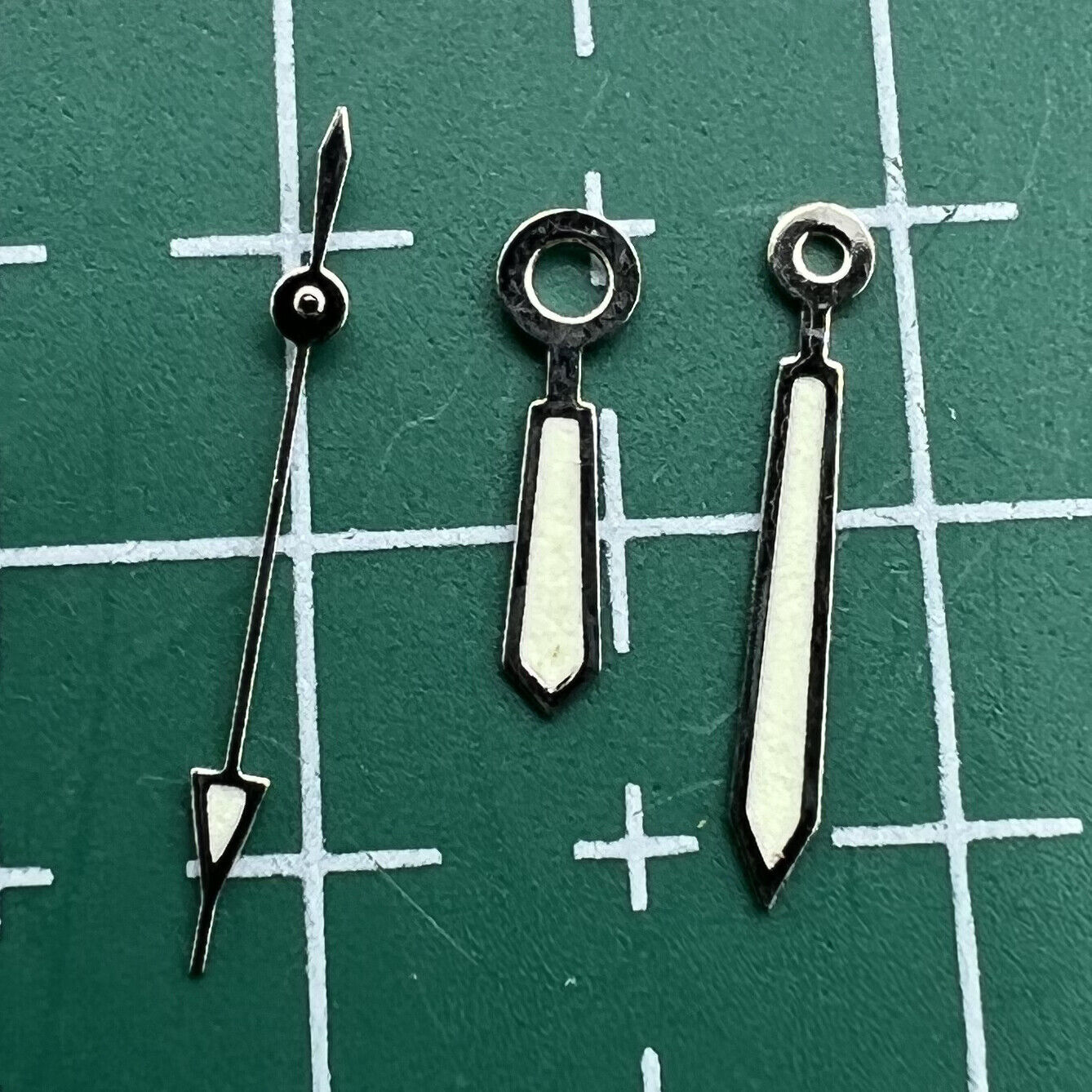 Luminous watch hands set by Miyota, compatible with 2115 movement, sizes 12mm, 11mm, 8mm for precise upgrades.