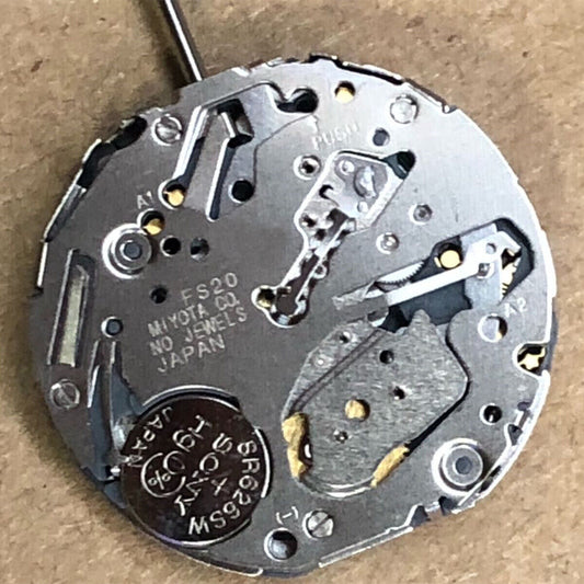 Miyota FS20 chronograph quartz watch movement with date at 3, precision Japanese craftsmanship.