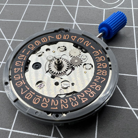 Seiko NH34 GMT watch movement with orange font, automatic mechanical caliber precision.