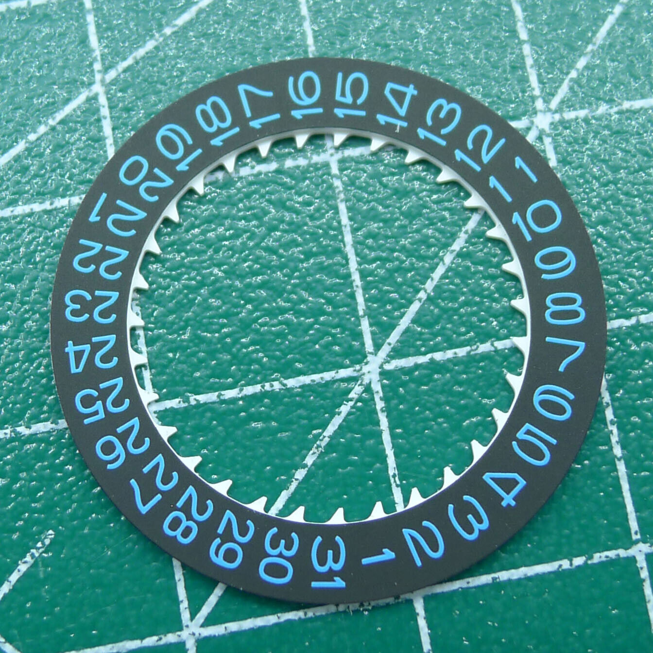 Blue font date disk wheel for NH35 watch movement on black background