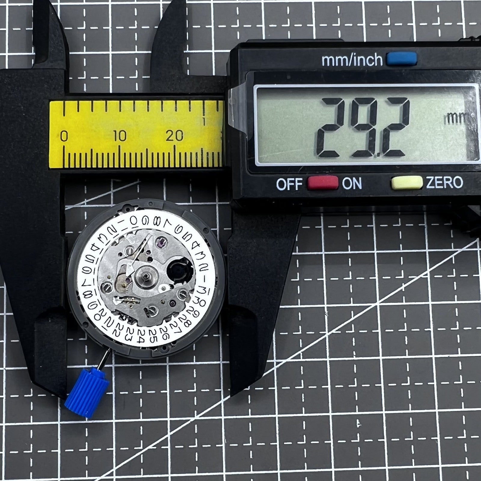 Seiko NH35 automatic watch movement with white dial, known for high accuracy and reliable timekeeping.