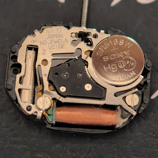 Japan-made TMI VC10E quartz watch movement with 2 hands, precision timekeeping part for watch repair.