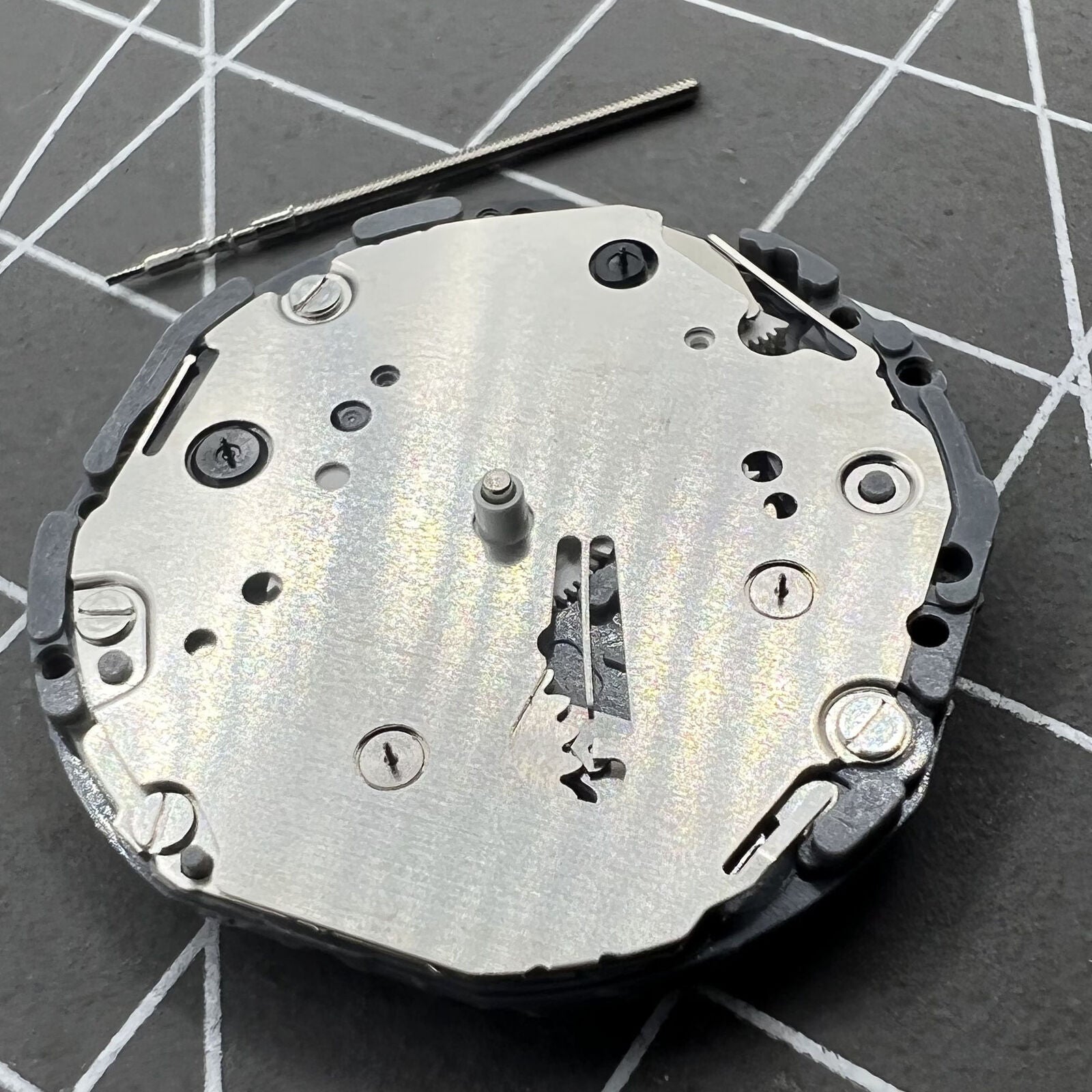 Hattori Epson TMI VD84 VD84A quartz watch movement showing precise inner mechanics and components.