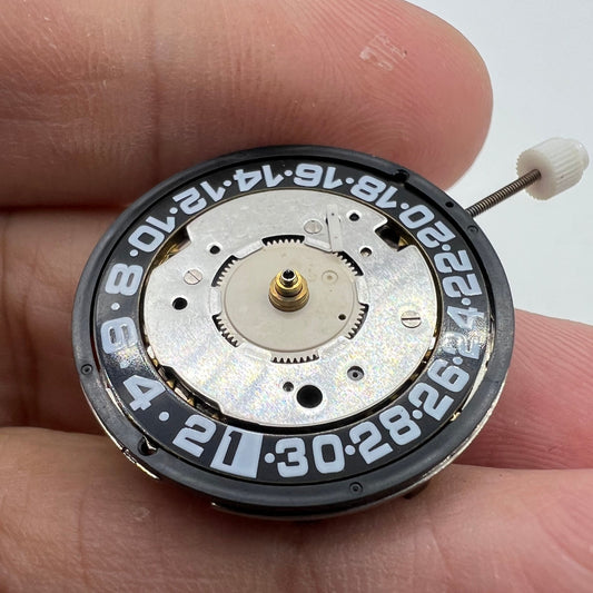 Original ISA8176A quartz watch movement with black dial, Swiss made for precise timekeeping.