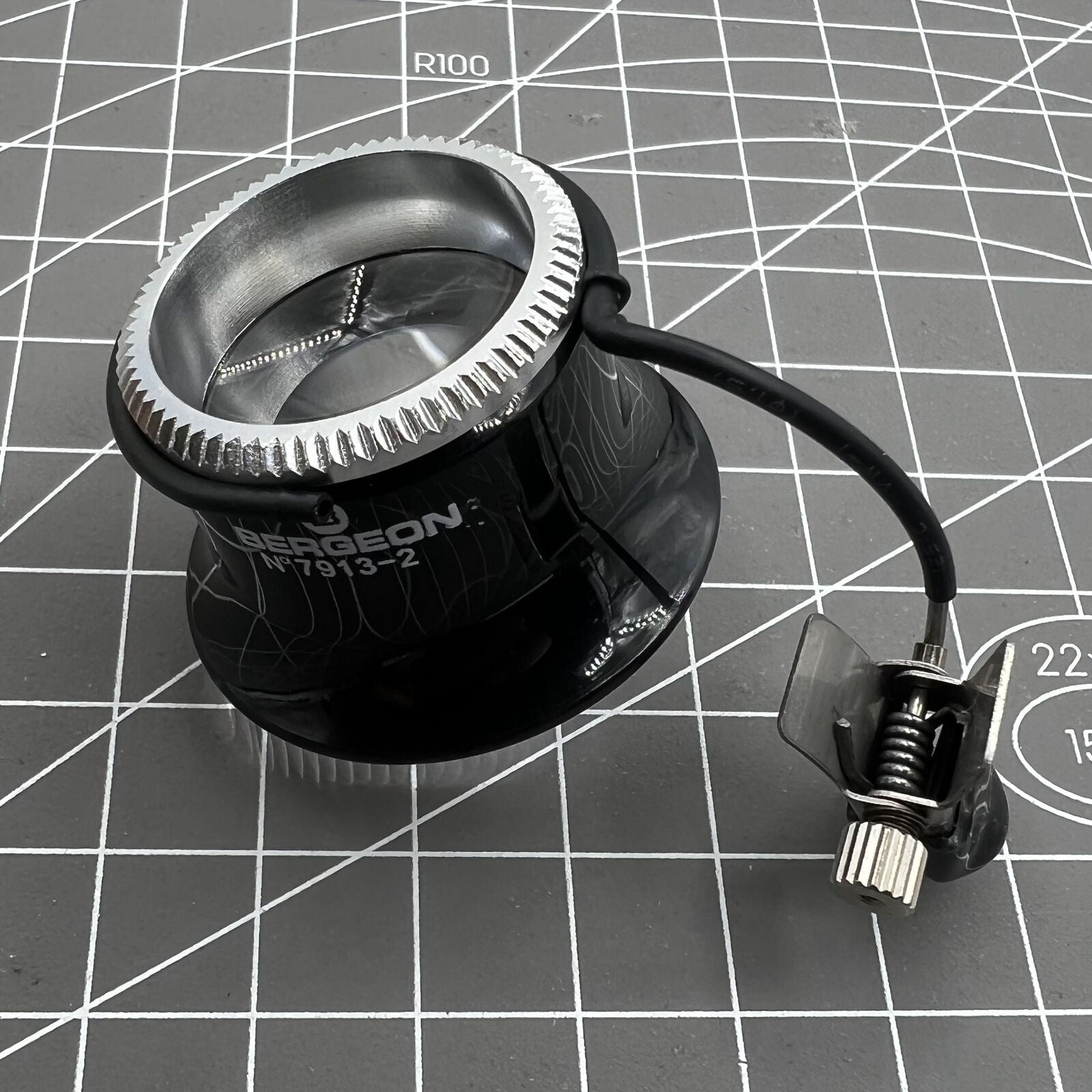 Swiss Bergeon watchmaker eyeglass with clip, magnification X3.3 X4 X5, ideal for precise watch repairs.