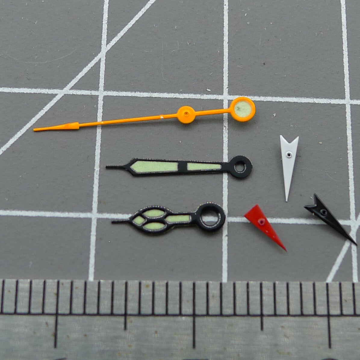 Black-trimmed luminous orange second hand for Miyota 0S80 movement, ideal for precise watch repairs.