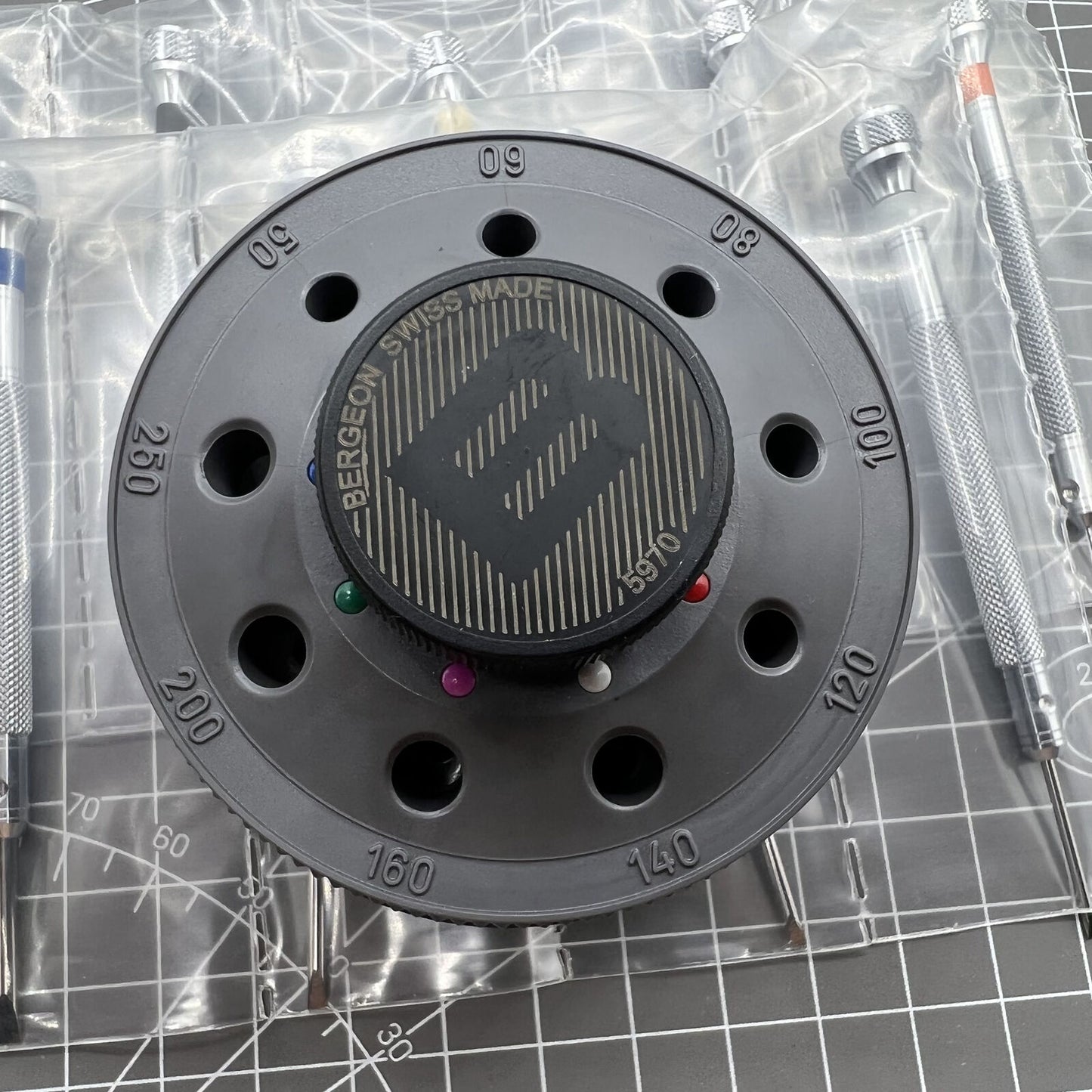 Bergeon 5970 Swiss Made rotating tool with 9 precision screwdrivers for detailed watch repairs and adjustments.