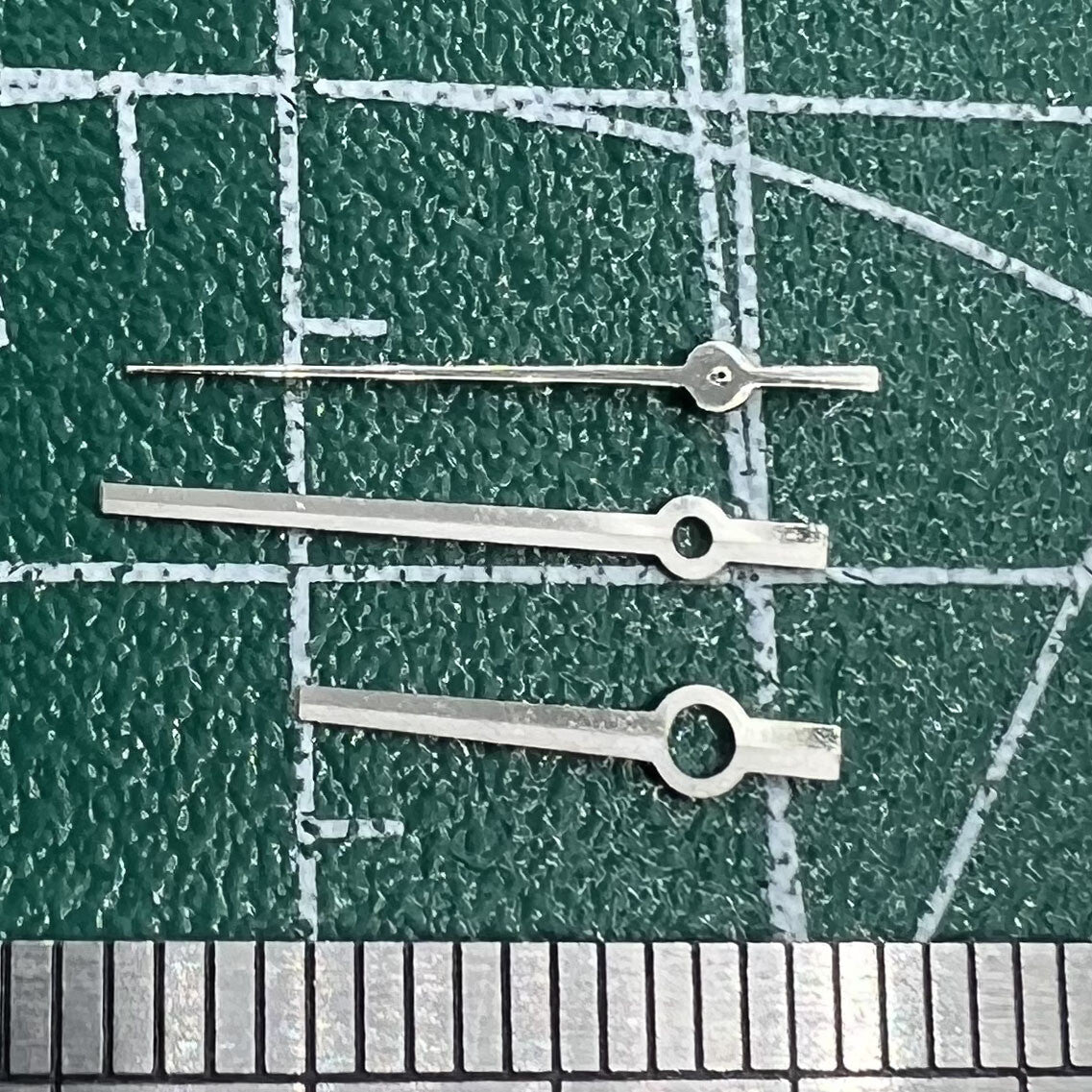Silver and black trimmed long watch hands for NH35/NH36/4R/7S movements, no lume finish, ideal for watch repairs.