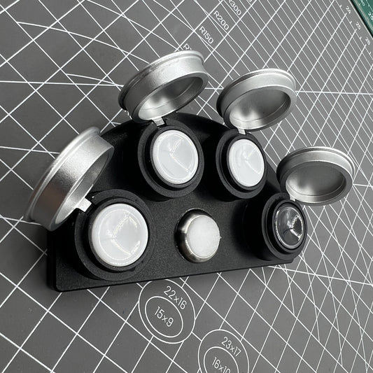 Die-cast alloy oil cup stand with 4 containers and black ceramic holders for watch maintenance.