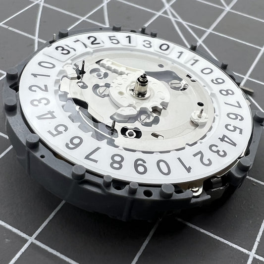 Japan Made Hattori Epson TMI VK73 Quartz watch movement, precise timekeeping mechanism for watches.