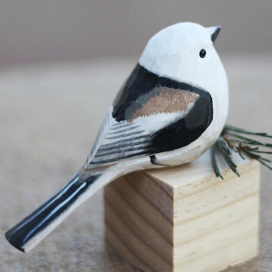 Handmade Long-tailed Tit wooden figurine, detailed decorative bird sculpture for home decor.