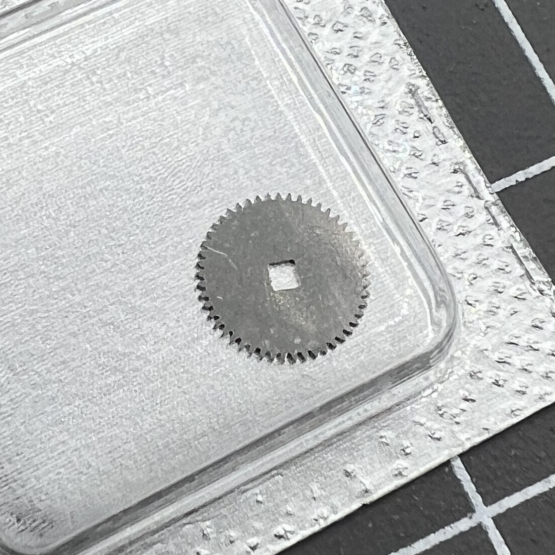Ratchet wheel replacement for ETA 2892 movement, precision spare part for watch repair.