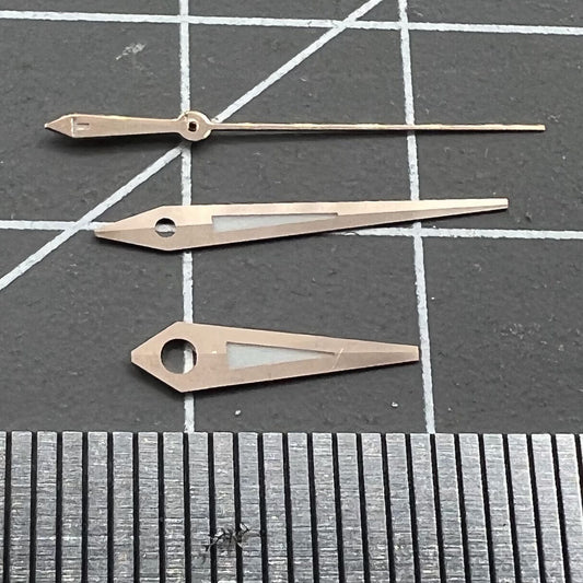 Rose gold trim watch hands with green lume, compatible with ETA2834, ideal for T035 models.