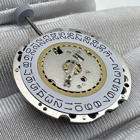 Swiss Made Ronda 705 quartz watch movement with date at 3 and 6 o'clock, precise timekeeping.