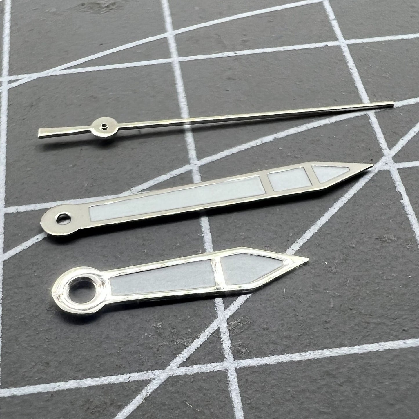 Silver 15.7mm watch hands with white paint and silver trim, compatible with Miyota 2315, 2035, 2036, 2115, 2305 movements.
