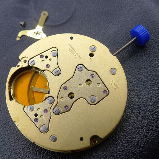 Ronda 5040B black disk quartz watch movement with golden components for precise timekeeping by Ronda.