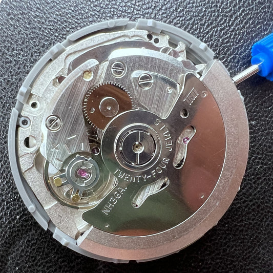 Seiko NH36 watch with automatic mechanical movement, black dial, golden font, and crown at 3 o'clock.