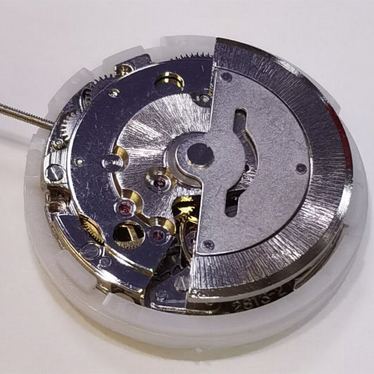 DG2813 automatic mechanical watch movement with day-date function, silver finish, ideal replacement part.
