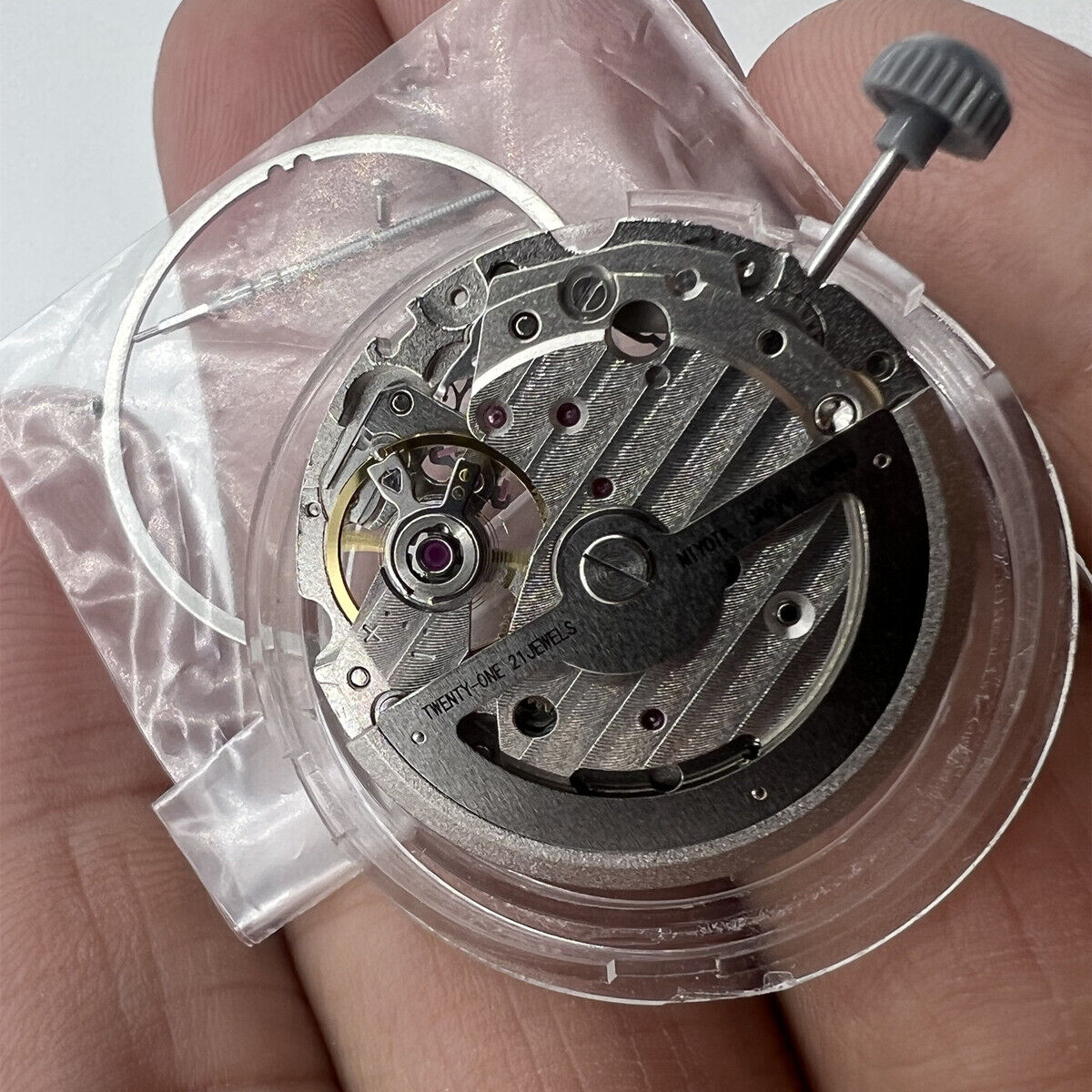 Miyota 82S0 silver plated automatic watch movement showcasing hollow design and precise Japanese engineering.