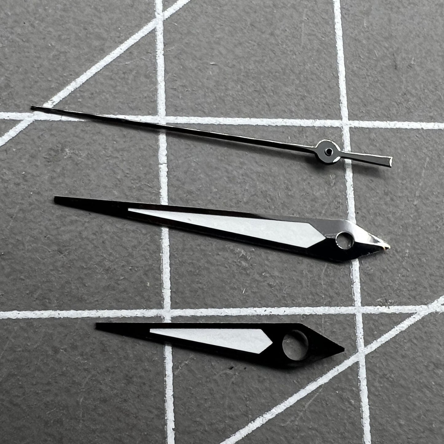 Black trimmed green luminous watch hands for NH35/NH36 movement, ensuring clear visibility and precise timekeeping.