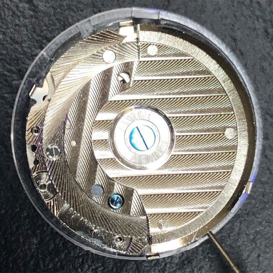 China Made automatic watch with reversed balance wheel, big date at 12, precise mechanical movement.