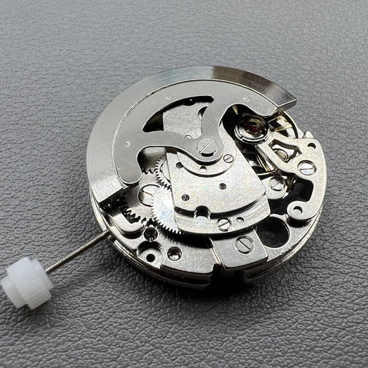 7120 Hollow silver automatic watch movement showcasing intricate mechanical gears and craftsmanship.