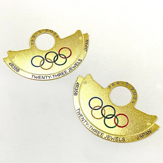 Golden Five Olympic Rings metal sheet overlay on NH35 rotor, enhancing Hammer watch accessories with branded detail.