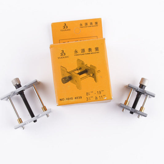 Metal watchmaker clamp with 2pcs movement holders for secure watch case repair tools.