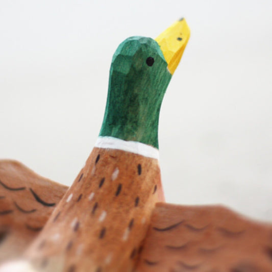 Handmade Flying Mallard wooden figurine, charming decor for watch accessory displays.