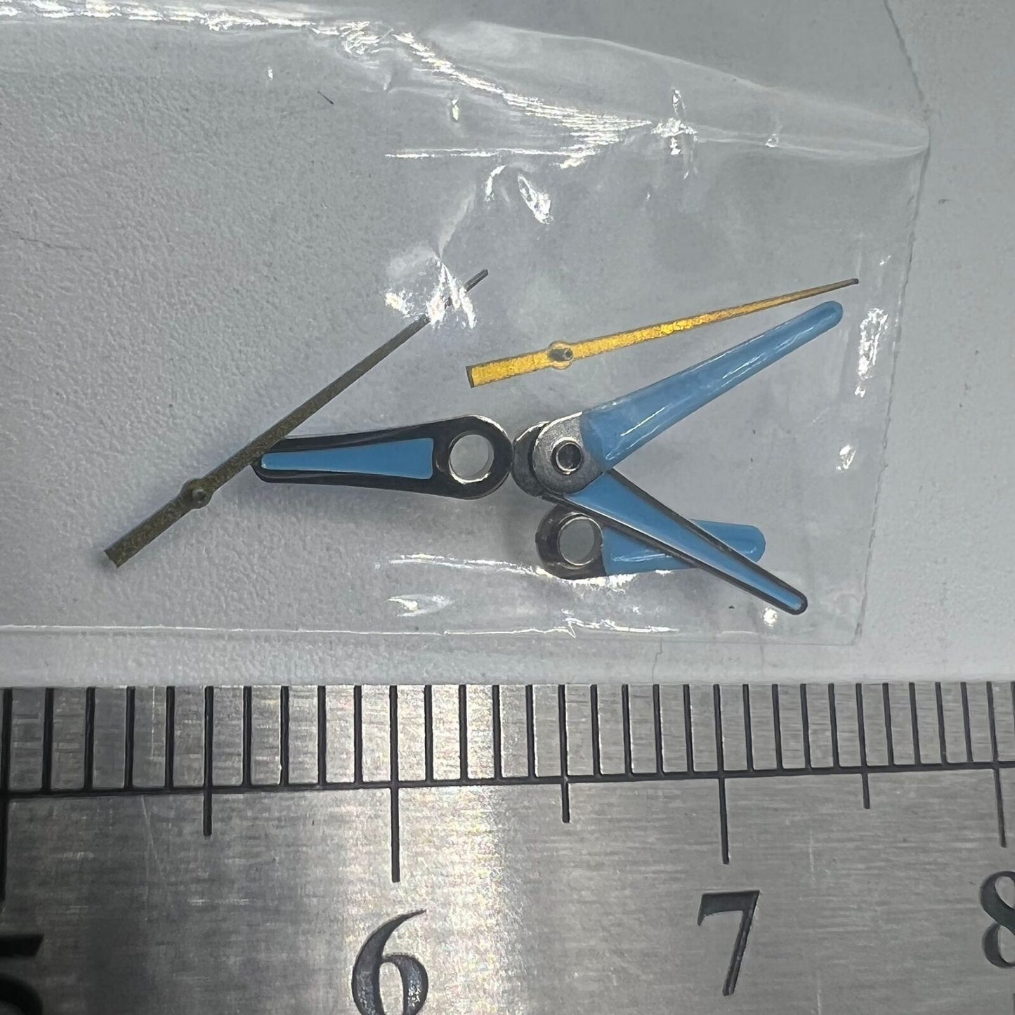 Set of blue painted watch hands by #1520 for Miyota 2035 movement, sizes 13mm, 11mm, and 9mm.