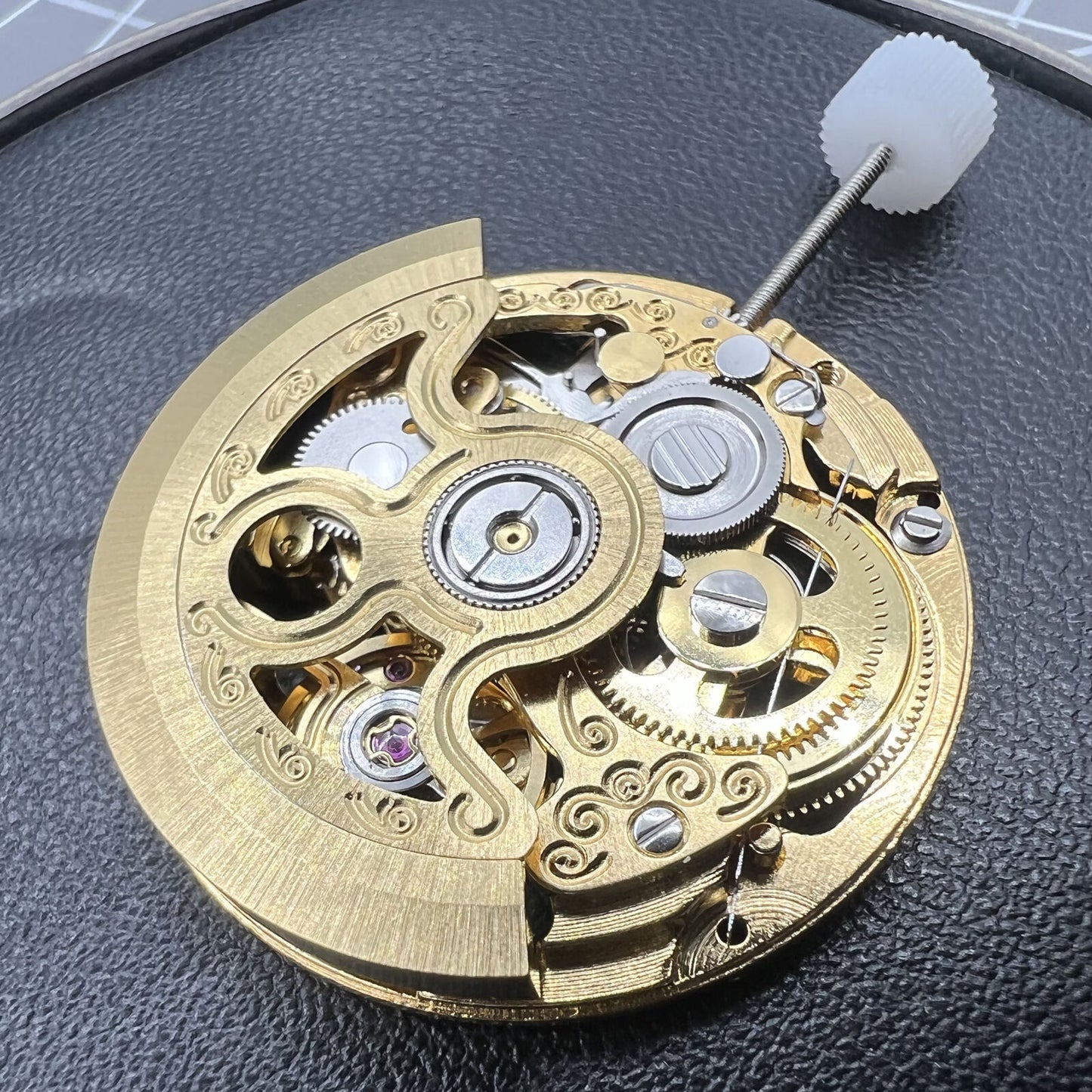 Hangzhou 2189 automatic watch movement featuring golden 3-hand skeleton design for accurate timekeeping.