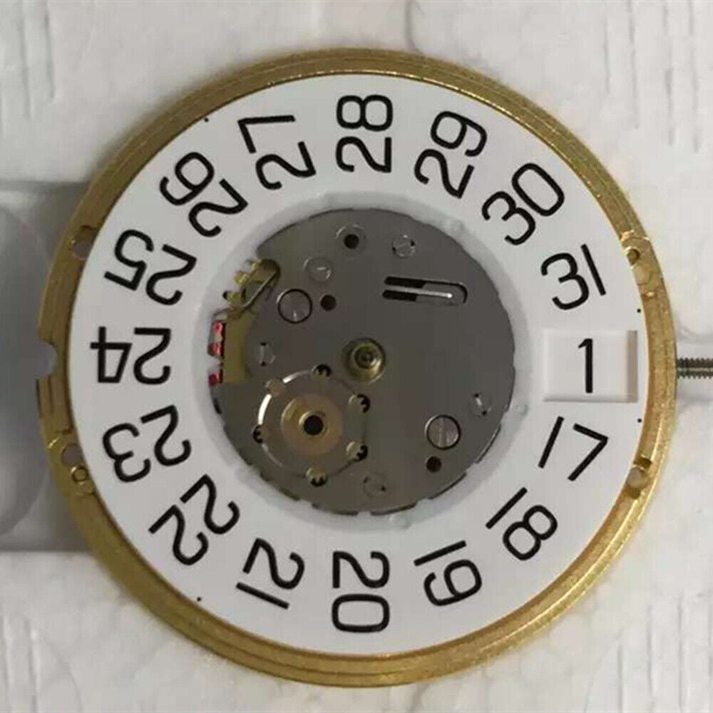 ETA F06.161 quartz watch movement displaying white dial with 3 hands and date window at 3, precision timekeeping